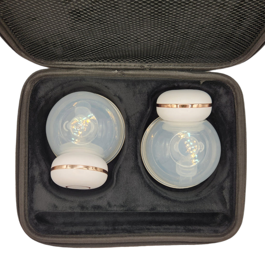 two mumilk pro breast pumps inside a travel case